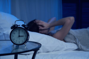 Person awake in the night, to illustrate cannabis for middle-of-the-night wakefulness