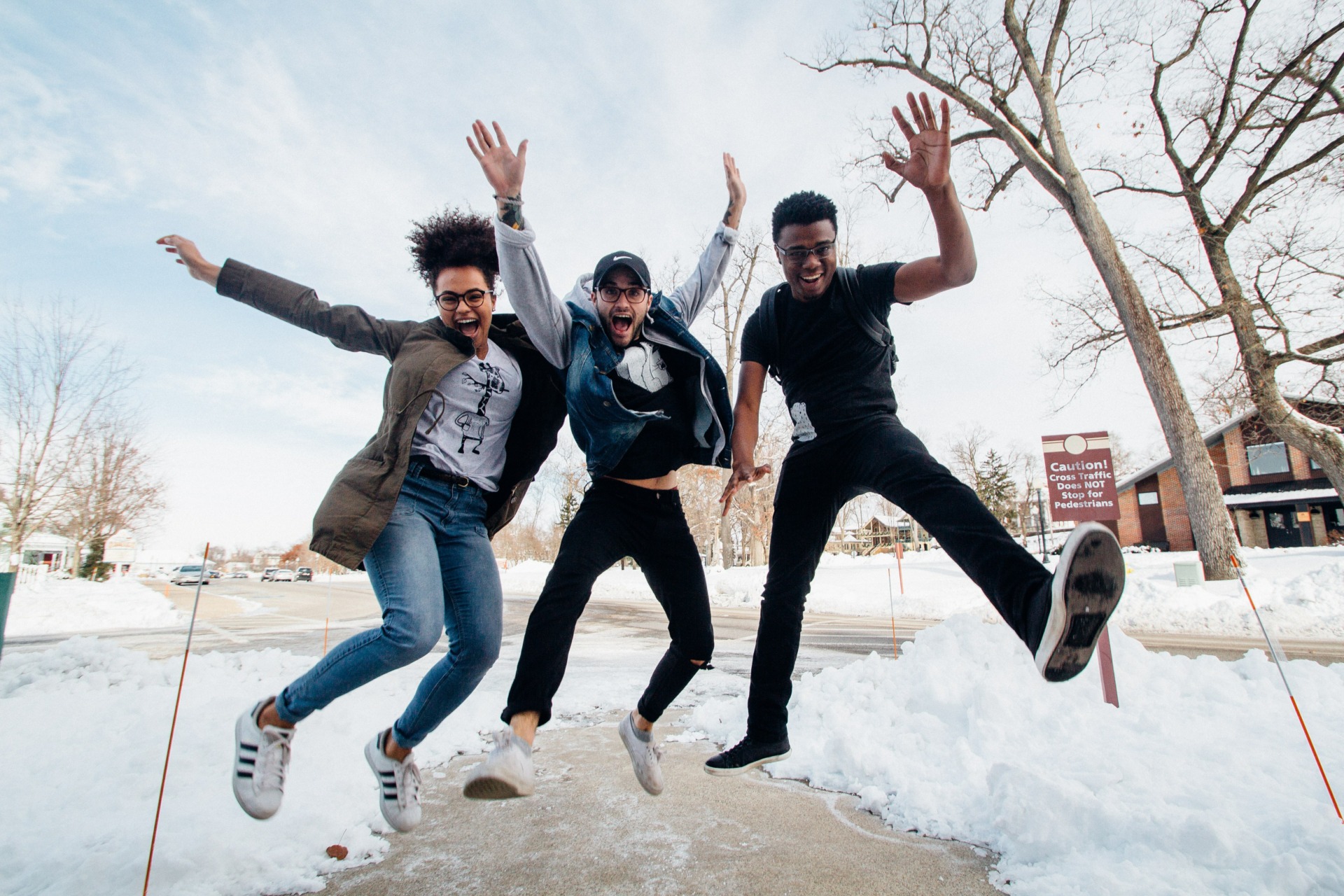 Group of people jumping outside in winter