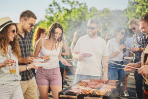Friends gathered around a BBQ, to illustrate cannabis strains to enjoy a more social summer