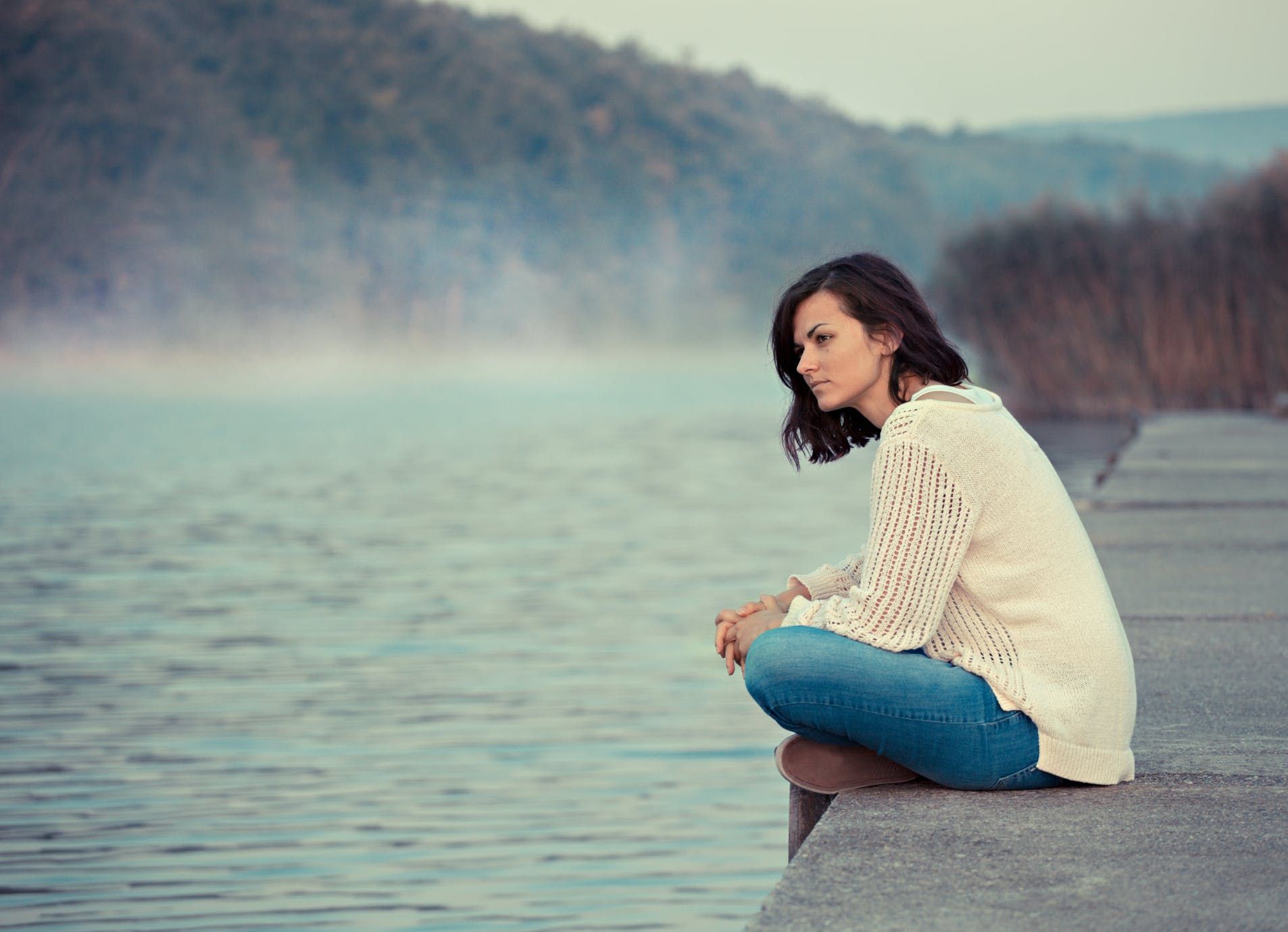 Women looking out into water, considering cannabis for Hashimoto's disease