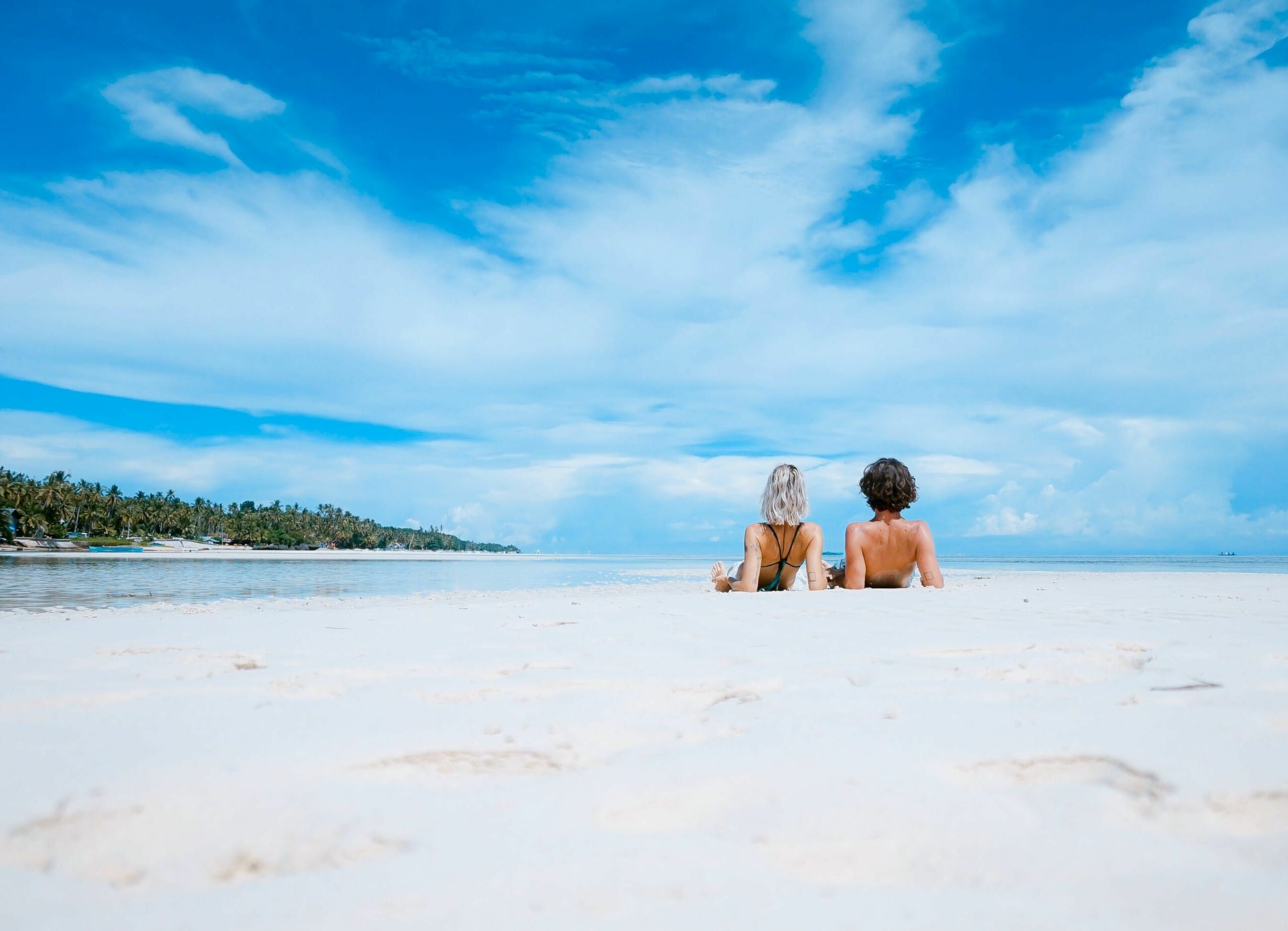 Couple on the beach for cannabis-friendly honeymoon destinations