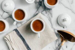 White mugs of cannabis-infused spicy turmeric hot cocoa